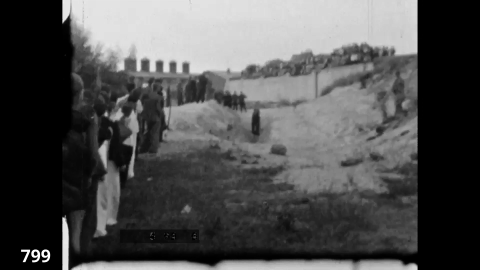 Screenshot from the Wiener Film mass execution in Liepaja 1942 fc 0799 - Execution pit, distant more Jews are shot